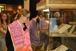 a visitor viewing a rare books and special collections library exhibtion
